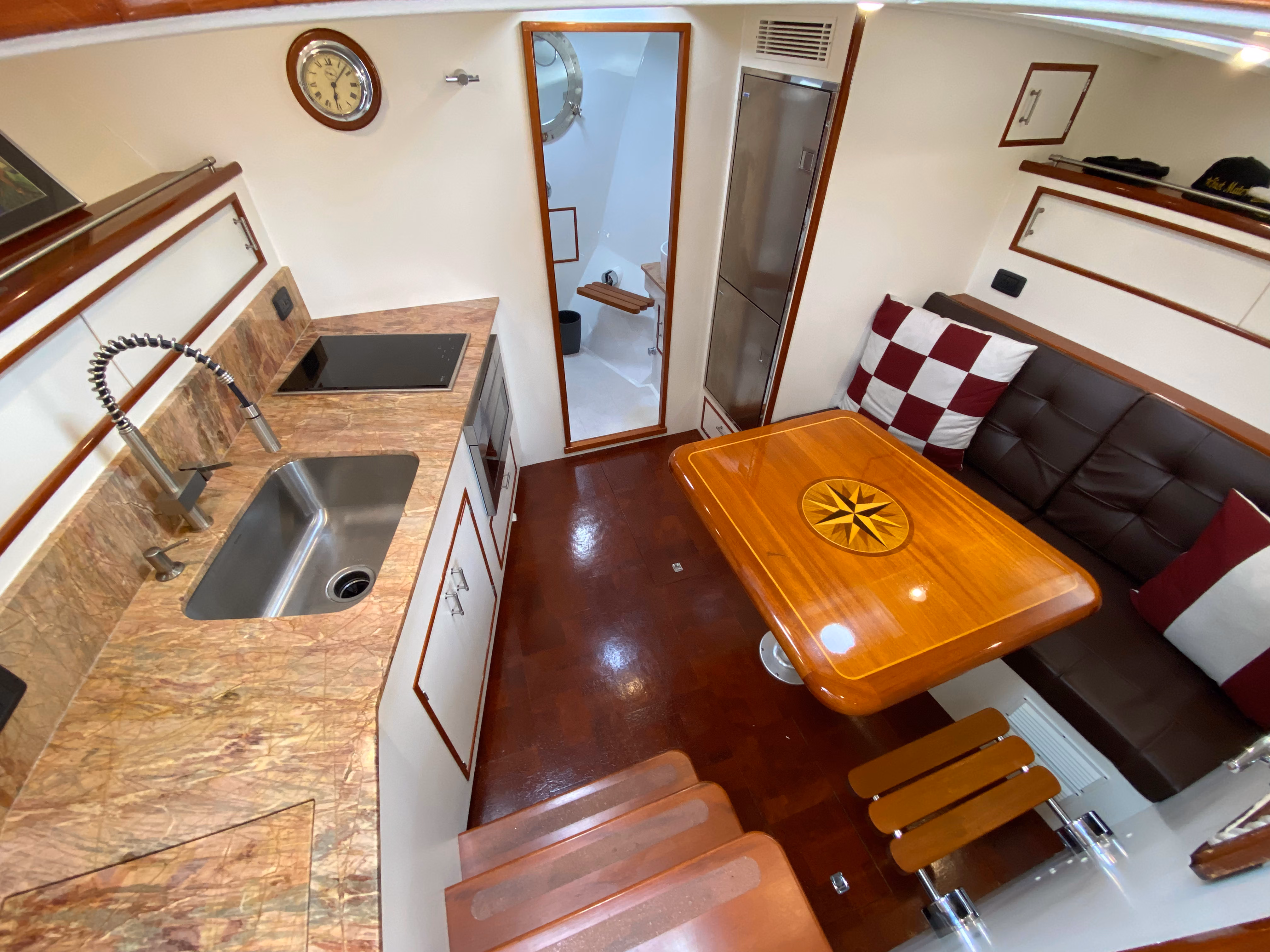 Deck and seating area of 1947 Huckins charter yacht